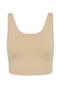 Beige, sømløs bralette med brede stropper, dyp utringning og støttende underbånd. Glatt, elastisk stoff uten lukking.