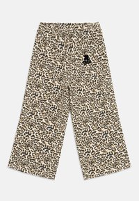 Hlače širokih nogavica s leopardovim vzorcem in elastičnim pasom. Bež osnovna barva z temno rjavimi in črnimi madeži. Imajo majhen črn logotip.