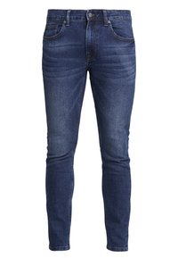 Jeans de mezclilla ajustados de color azul oscuro con una textura suave, que cuentan con cinco bolsillos y un ligero efecto de desgaste en los muslos. Cierre con botón metálico y cremallera.