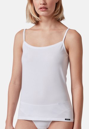 White cotton camisole with thin shoulder straps, a scoop neckline, smooth texture, and a logo label on the bottom left.