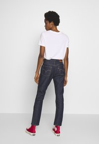 Levi's® 501® FOR WOMEN - Calças de ganga de perna direita - across a plane