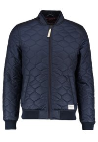 Marinblå quiltad bomberjacka med hexagonmönster, hel dragkedja, ribbade ärmslut och nederkant samt ståkrage. Lätt syntetmaterial.