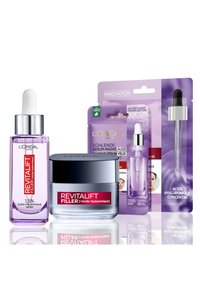 Flacon de sérum Revitalift Filler avec pipette, en verre violet, contenant 1,5 % d'acide hyaluronique ; pot de crème avec couvercle argenté ; emballage violet pour le masque pour les yeux.