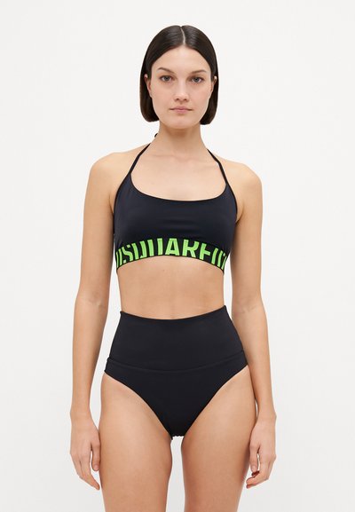 Black bikini set featuring a cropped top with a neon green logo band and high-waisted bottoms, designed in smooth, stretchy fabric.
