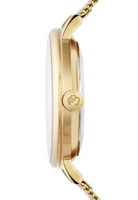 Hodinky v zlatém tónu s kulatým pouzdrem, texturovanou korunkou a páskem s krajkovým vzorem. Mají hladký, průhledný ciferník a lesklé kovové detaily.