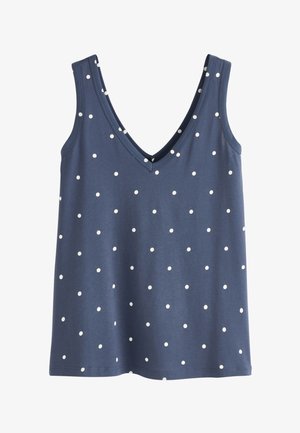 Débardeur bleu marine sans manches avec des pois blancs et un col en V.