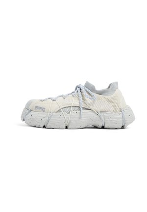 White and gray sneaker with a mesh upper, textured rubber sole, and prominent lacing system featuring gray accents and black speckles.
