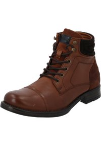 Stivale alla caviglia in pelle marrone con design con lacci, punta rotonda e dettagli in suede nero testurizzato alla collo. Occhielli in metallo per i lacci.