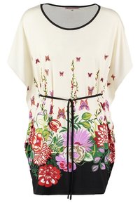 Robe tunique florale en crème avec un ourlet noir. Présente des fleurs colorées et des papillons, un tissu léger et une taille à cordon.