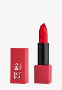 Red lipstick in a black and red square tube. The bullet is pointed with a smooth texture. Packaging features white text and logo.