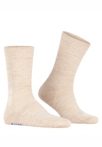 Meias beges caneladas com textura felpuda, com altura até à metade da canela e detalhes azuis na lateral. Material macio e elástico para maior conforto.