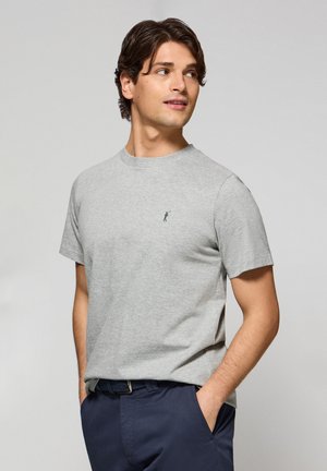 Gray cotton T-shirt with short sleeves, crew neck, featuring a small embroidered logo in navy. Smooth texture and casual fit.