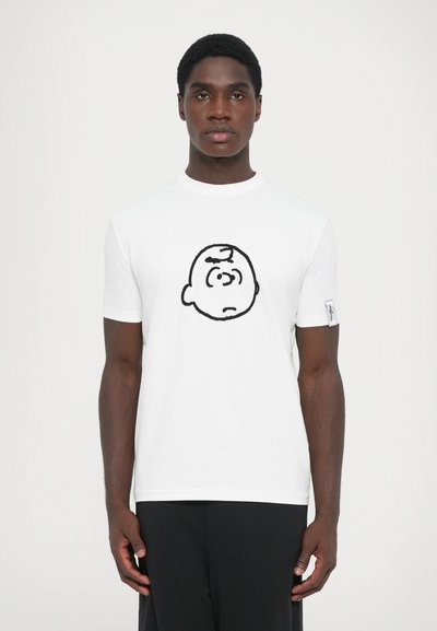 White short-sleeve t-shirt featuring a black outline cartoon face design on the front. Smooth fabric with a classic crew neckline.