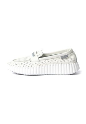 White perforated slip-on shoe with thick ribbed sole and a strap detail across the top, shown in side profile on a white background.