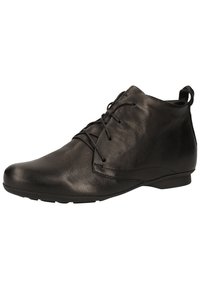 Bottines en cuir noir avec une texture lisse, bout rond et fermeture à lacets, présentant un design minimaliste et une semelle plate en caoutchouc.