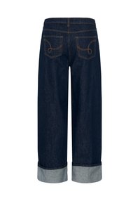 Mørk denim capribukser med brede ben, der har opkrullede kanter og buede baglommer med orange syning.