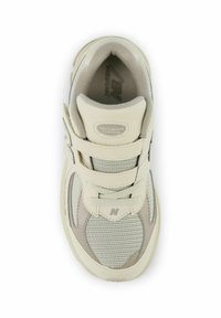 Light gray athletic shoe with suede and mesh material, lace-up design, padded collar, and "N" logo on the side. Features textured accents.