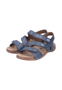 Navy blue leather sandals with wide crossstraps, a cushioned insole, and a textured brown outsole. Metal accent detail on straps.