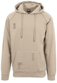 Beige hoodie with a front kangaroo pocket, distressed details, drawstrings, and ribbed cuffs. Made from soft, textured fabric.