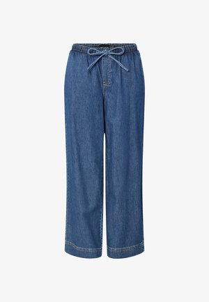 Keskmise sinise värvusega denimist tõmmatud püksid, millel on elastne vöökoht ja nöör. Omavad laia jala lõiget ja õmblusega mõlemat äärte detaili.