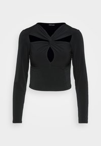 Svart långärmad crop top med en vriden frontdesign och nyckelhålsutsparningar, tillverkad av mjukt, elastiskt material.
