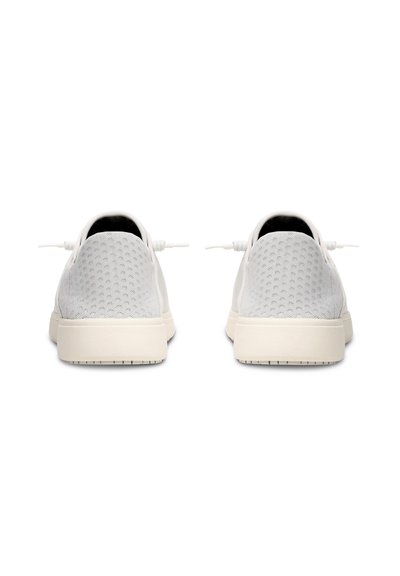 Light gray mesh sneakers with a textured upper, circular perforations, and white rubber soles. Features elastic laces and a minimal design.