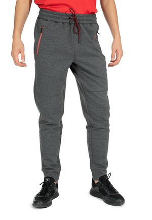 Grijze joggingbroek van gestructureerde stof, met zwarte en rode ritszakken en een elastische tailleband met trekkoord.