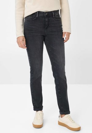 Zwarte jeans van denim met een slim fit, met een hoge taille, vijf zakken en metalen accenten aan de voorkant. Getextureerde stof met een lichte rek.