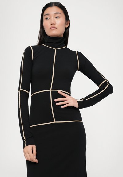 Black turtleneck dress featuring beige geometric patterns. Long sleeves with fitted design, made from stretchy, smooth fabric.