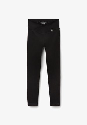 Schwarze Leggings aus dehnbarem Stoff mit einem breiten Taillenbund und einer glatten Textur. Keine sichtbaren Muster oder zusätzlichen Akzente.