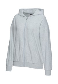 Helle graue Zip-Hoodie aus weichem Stoff, mit Kapuze, langen Ärmeln und zwei Fronttaschen. Gerippte Bündchen und Saum.