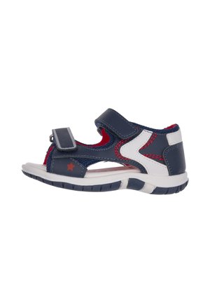 Børn sandaler i blå og hvid med velcrolukning, gummisåler og røde detaljer. Har en stjerneudsmykning og udskæringer for ventilation.
