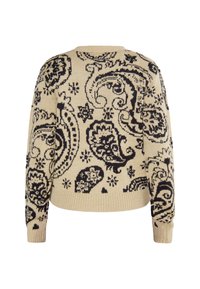 Beige stickad tröja med ett svart paisleymönster, ribbade ärmslut och nederkant samt en avslappnad passform.