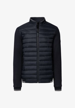 Męska hybrydowa kurtka w kolorze granatowym z pikowanym przodem, dzianinowymi rękawami, zamkiem błyskawicznym i paskowanymi detalami na kołnierzu i mankietach.