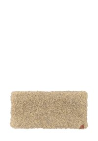 Beige wool rug with a soft, textured surface. Rectangular shape with slightly rounded edges and a small leather tag in the corner.
