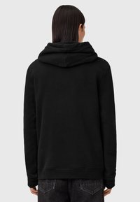 Haut de sweatshirt en polaire noir avec une grande capuche à double épaisseur et des poignets côtelés. Texture lisse et coupe décontractée avec un détail de couture verticale à l'arrière.