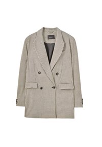 Blazer croisé à motif à carreaux noir et blanc. Comprend un col cranté, deux poches avant et des boutons décoratifs.