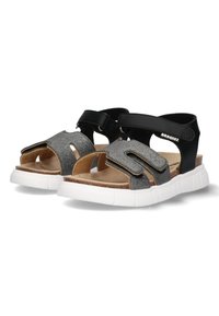Sorte og sølv glitrende sandaler med åben tå design, justerbare stropper og en hvid gummisål, der har en tekstureret fodseng.