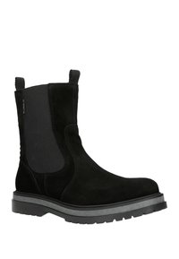 Stivaletto nera in suede con pannelli laterali elastici, linguette di aderenza e una suola in gomma grigia texture. Presenta una punta arrotondata e cuciture lisce.