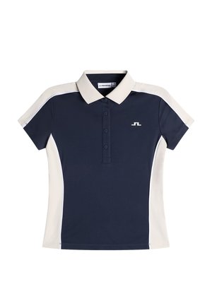 Polo à manches courtes bleu marine et beige avec patte de boutonnage, panneaux latéraux contrastants et petit logo blanc sur la poitrine.