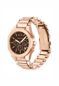 Roségoldene Edelstahl-Uhr mit achteckigem Gehäuse, schwarzem Zifferblatt, leuchtenden Zeigern, Unterzifferblättern und einem Datumsfenster. Verstellbares Armband.
