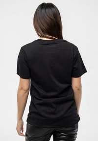 Paradiso Clothing ELTON JOHN DIAMANTE E LOGO - Print T-shirt - black