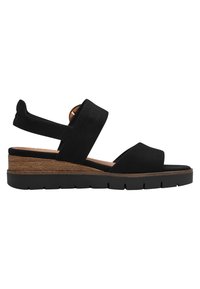 Infradito nere con cinturini in suede, tacco simile a legno e suola in gomma testurizzata. Presentano una cinghia alla caviglia e un design con punta aperta.