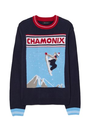Suéter azul marino con un gráfico de "Chamonix" que presenta una figura de snowboard, montañas y un fondo azul. Detalles en rojo y azul claro.