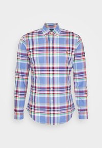 Camicia a maniche lunghe con bottoni, caratterizzata da un motivo a quadri blu con accenti rossi, verdi e bianchi. Realizzata in cotone, con un design di colletto classico.