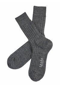 Calcetines grises acanalados con una textura suave, que cuentan con una puntera y un talón reforzados. El logotipo de la marca está impreso en la suela.