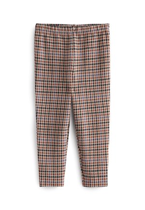 Pantalon slim longueur cheville avec un motif pied-de-poule multicolore en noir, rouge et beige sur fond blanc.