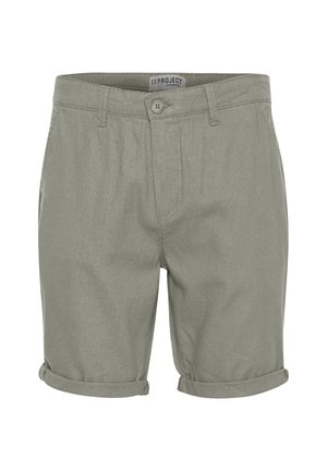 Shorts en coton verts avec ourlet roulé, fermeture à bouton à l'avant et deux poches latérales ; tissu léger au toucher doux.