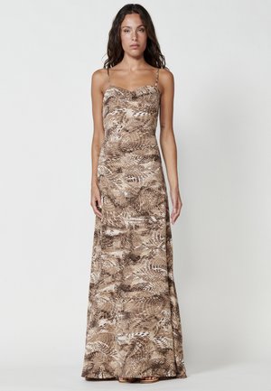 Brown maxi dress with spaghetti straps, featuring a fern pattern. Smooth fabric with a fitted bodice and flowing skirt.