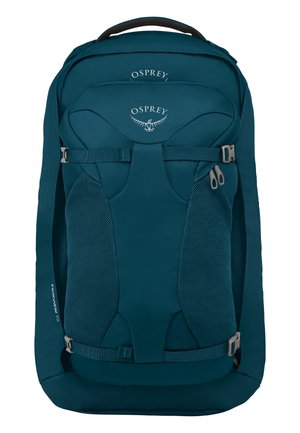 Teal nylon rugzak met mesh zijvakken, verstelbare schouderriemen, een handvat aan de bovenkant en zilverkleurige hardware. Bevat een logo op het frontpaneel.
